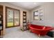 Bright bathroom showcasing red clawfoot tub, marble tile, and natural light from window at 1755 W Lawrence Ln, Phoenix, AZ 85021