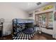 Cozy bedroom featuring loft bed, fun decor, and natural light at 1755 W Lawrence Ln, Phoenix, AZ 85021