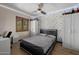 Stylish bedroom features a gray bed frame, modern accent wall, and ample closet space at 1755 W Lawrence Ln, Phoenix, AZ 85021