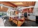 Stylish kitchen featuring a wood ceiling, custom cabinets, and stainless steel appliances at 1755 W Lawrence Ln, Phoenix, AZ 85021