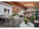 Spacious living room featuring a wood ceiling, tile floors, and abundant natural light at 1755 W Lawrence Ln, Phoenix, AZ 85021