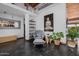 Bright living room with clerestory windows, slate flooring, and decorative shelving at 1755 W Lawrence Ln, Phoenix, AZ 85021