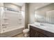 Bathroom featuring a shower-tub combo with a single sink vanity at 17842 W Getty Dr, Goodyear, AZ 85338