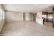 Open living area showcasing the kitchen, large tile flooring, and lots of natural light at 17842 W Getty Dr, Goodyear, AZ 85338