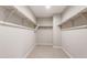 This ample walk-in closet is complete with carpet flooring and ample shelving at 17842 W Getty Dr, Goodyear, AZ 85338