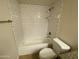 Bathroom with a toilet and a bathtub shower combo with white subway tile at 200 E Southern Ave # 348, Tempe, AZ 85282