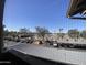 Elevated view of parking area with cars, trees, clear skies, and surrounding buildings at 200 E Southern Ave # 348, Tempe, AZ 85282