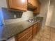 Neutral backsplash and stainless steel sink highlight this efficient kitchen area at 200 E Southern Ave # 348, Tempe, AZ 85282