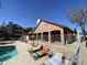 Community pool area featuring lounge chairs, well-kept landscaping and a brick building at 200 E Southern Ave # 348, Tempe, AZ 85282