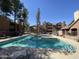 Relaxing community pool surrounded by lush landscaping and apartment buildings at 200 E Southern Ave # 348, Tempe, AZ 85282