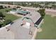 Aerial view of a barn and property featuring a large barn, corrals, mature trees, and ample space at 2025 S Val Vista Dr, Gilbert, AZ 85295