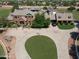 Expansive estate featuring a circular driveway, mature trees, and a well-manicured lawn at 2025 S Val Vista Dr, Gilbert, AZ 85295