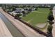 Aerial shot of a property featuring a canal, fencing, and a large field at 2025 S Val Vista Dr, Gilbert, AZ 85295