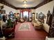 Cozy living room with vintage furniture, carpet and a decorative rug at 2025 S Val Vista Dr, Gilbert, AZ 85295