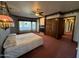 Main bedroom featuring carpet, ceiling fan, and private access to ensuite at 2025 S Val Vista Dr, Gilbert, AZ 85295