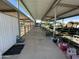 Covered outdoor shelter for farm animals with metal roofing and posts, and partial metal fencing at 2025 S Val Vista Dr, Gilbert, AZ 85295