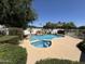 Backyard pool and spa featuring a rock waterfall feature and surrounding landscape at 2025 S Val Vista Dr, Gilbert, AZ 85295