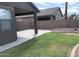 View of back yard featuring lush lawn and a large covered patio and surrounded by block wall fencing at 20840 E Vía Del Palo --, Queen Creek, AZ 85142