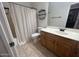 Well-lit bathroom featuring a shower with curtain, toilet, and vanity with countertop sink at 20840 E Vía Del Palo --, Queen Creek, AZ 85142