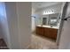 Spacious bathroom featuring a double sink vanity and a large mirror at 20840 E Vía Del Palo --, Queen Creek, AZ 85142