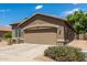 Charming one-story home with a well-maintained front yard and a two-car garage at 20840 E Vía Del Palo --, Queen Creek, AZ 85142