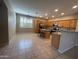 This kitchen features a kitchen island, bar seating, and stainless steel appliances at 20840 E Vía Del Palo --, Queen Creek, AZ 85142