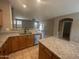 Bright and open kitchen featuring a center island, stainless appliances, and tile flooring at 20840 E Vía Del Palo --, Queen Creek, AZ 85142