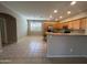 Open kitchen featuring stainless steel appliances, granite countertops, and tile flooring at 20840 E Vía Del Palo --, Queen Creek, AZ 85142