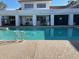 Community pool with a white cabana area and fencing at 20840 E Vía Del Palo --, Queen Creek, AZ 85142