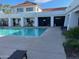 Community pool area with a pool, a white building, and palm trees at 20840 E Vía Del Palo --, Queen Creek, AZ 85142