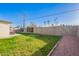 The backyard is complete with gravel walkways and a lush lawn, perfect for outdoor enjoyment at 2301 E Alpine E Ave, Mesa, AZ 85204