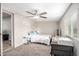 Cozy bedroom featuring neutral paint, ceiling fan, and a window providing natural light at 2301 E Alpine E Ave, Mesa, AZ 85204