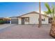 Charming single-story home with a well-manicured front yard and attached garage at 2301 E Alpine E Ave, Mesa, AZ 85204