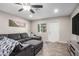 Comfortable living room showcases a gray sectional sofa, adjacent to a well-lit white door at 2301 E Alpine E Ave, Mesa, AZ 85204