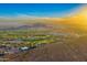 Expansive aerial view of a luxury golf community set against a desert backdrop at 2430 S Geronimo Head Trl, Gold Canyon, AZ 85118