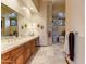 Bathroom with dual sinks, custom vanity, and a separate bathtub, creating a spa-like oasis at 2430 S Geronimo Head Trl, Gold Canyon, AZ 85118