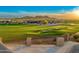 Scenic view of a lush golf course with beautifully landscaped homes in the background at 2430 S Geronimo Head Trl, Gold Canyon, AZ 85118