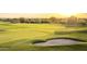 Scenic view of a lush green golf course with a sand trap at 2430 S Geronimo Head Trl, Gold Canyon, AZ 85118