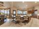 Spacious kitchen with seated island, blending into the dining area offering plentiful natural light and open floorplan at 2430 S Geronimo Head Trl, Gold Canyon, AZ 85118