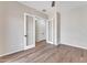 Empty bedroom with wood-look tile and modern style doors at 2458 E Lark St, Gilbert, AZ 85297