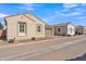 Street view showcases this single-story home with a two-car garage and low maintenance landscaping at 2458 E Lark St, Gilbert, AZ 85297