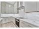 Bright kitchen with stainless steel appliances, white cabinets, and modern backsplash at 2458 E Lark St, Gilbert, AZ 85297