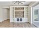 Living room featuring a custom media center with stone accents at 2458 E Lark St, Gilbert, AZ 85297