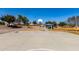 Community basketball court with a hoop and shaded picnic areas nearby for recreation at 2478 W Allens Peak Dr, San Tan Valley, AZ 85144