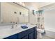 Bathroom with a vanity featuring double sinks, a large mirror, and colorful accents at 2478 W Allens Peak Dr, San Tan Valley, AZ 85144