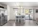 Charming dining area with view of the pool through sliding doors at 2478 W Allens Peak Dr, San Tan Valley, AZ 85144