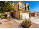 Attractive two-story house with a well-manicured yard and attached two-car garage at 2478 W Allens Peak Dr, San Tan Valley, AZ 85144