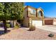 Beautiful exterior view of two-story home featuring desert landscaping and attached garage at 2478 W Allens Peak Dr, San Tan Valley, AZ 85144