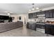 Open kitchen with stainless steel appliances and plenty of counter space at 2478 W Allens Peak Dr, San Tan Valley, AZ 85144