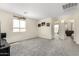 Spacious living room with carpeted floors and natural lighting at 2478 W Allens Peak Dr, San Tan Valley, AZ 85144